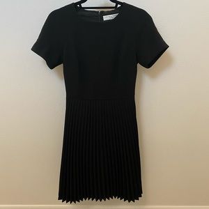 Sophisticated Black Trina Turk dress with pleated skirt - size 0